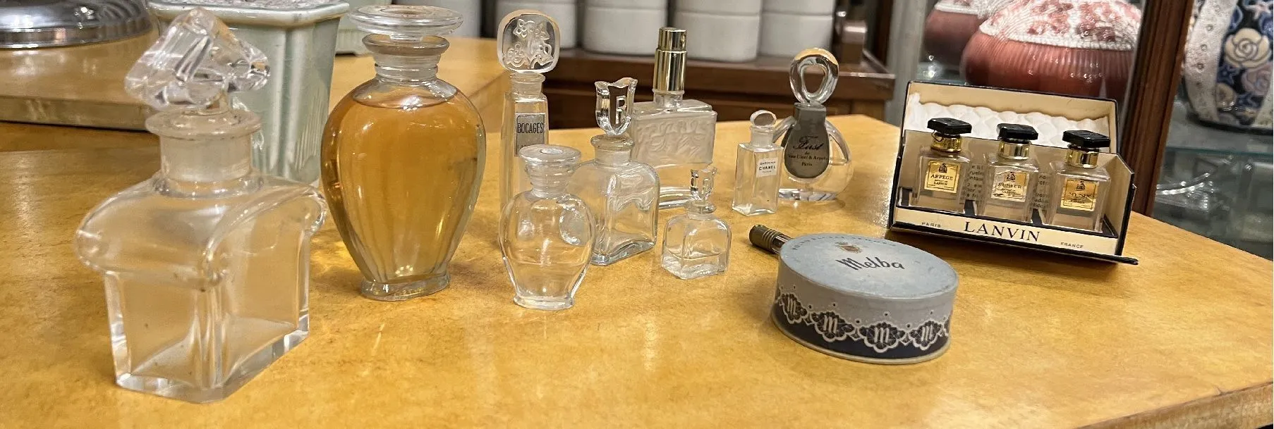 Collection of antique perfume bottles on a table